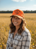 A Little On The Trashy Side Orange Camo Trucker Hat by Wild Junkie