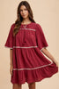Tassel Contrast Trim Tie Neck Half Sleeve Tiered Dress – Bohemian-Inspired Dress with Tassel Details, Adjustable Tie Neck, and Tiered Design for a Flowing, Feminine Silhouette by Stevvex