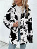 Trendy Black White Cozy Cow Print Collared Neck Button Up Fuzzy Jacket Modern & Warm Outerwear by Stevvex