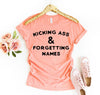 Kicking Ass & Forgetting Names T-shirt by T-Shirt Crazed