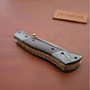 Handmade Damascus Steel Folding Knife – Matte Black Handle with Brass Liner & Thumb Stud | JW SteelCrafts by JW SteelCrafts