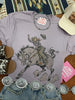 Halloween Cowgirl Bucking Horse Graphic Tee by Wild Junkie