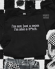 Not just a mom embroidered sweatshirt by Madness & Mayhem LLC