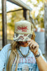 Raisin' Hell Green Camo Trucker Hat by Wild Junkie