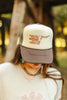 Raisin' Hell With Hippies & Cowboys Trucker Hat by Wild Junkie