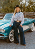 Saddle Oiled Raw Hem V-Neck Graphic by Wild Junkie