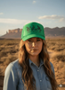 Saddle Up And Enjoy The Ride Trucker Hat by Wild Junkie